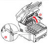 3. Push lever (a) to release OKI ES8460 toner cover and lift in the direction of arrow (b).